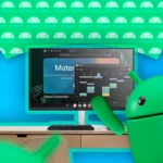 Giao diện chế độ desktop Android 16 hiển thị trên màn hình, cùng linh vật Android