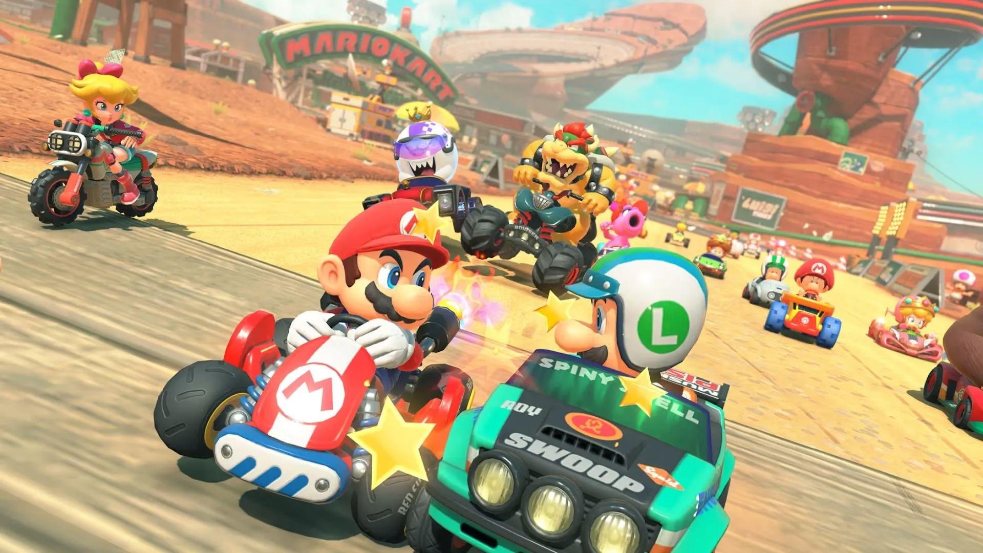 Cảnh đua xe Mario Kart World, nhân vật đang di chuyển trên tường, minh họa tính năng wall driving, mở rộng không gian đường đua.