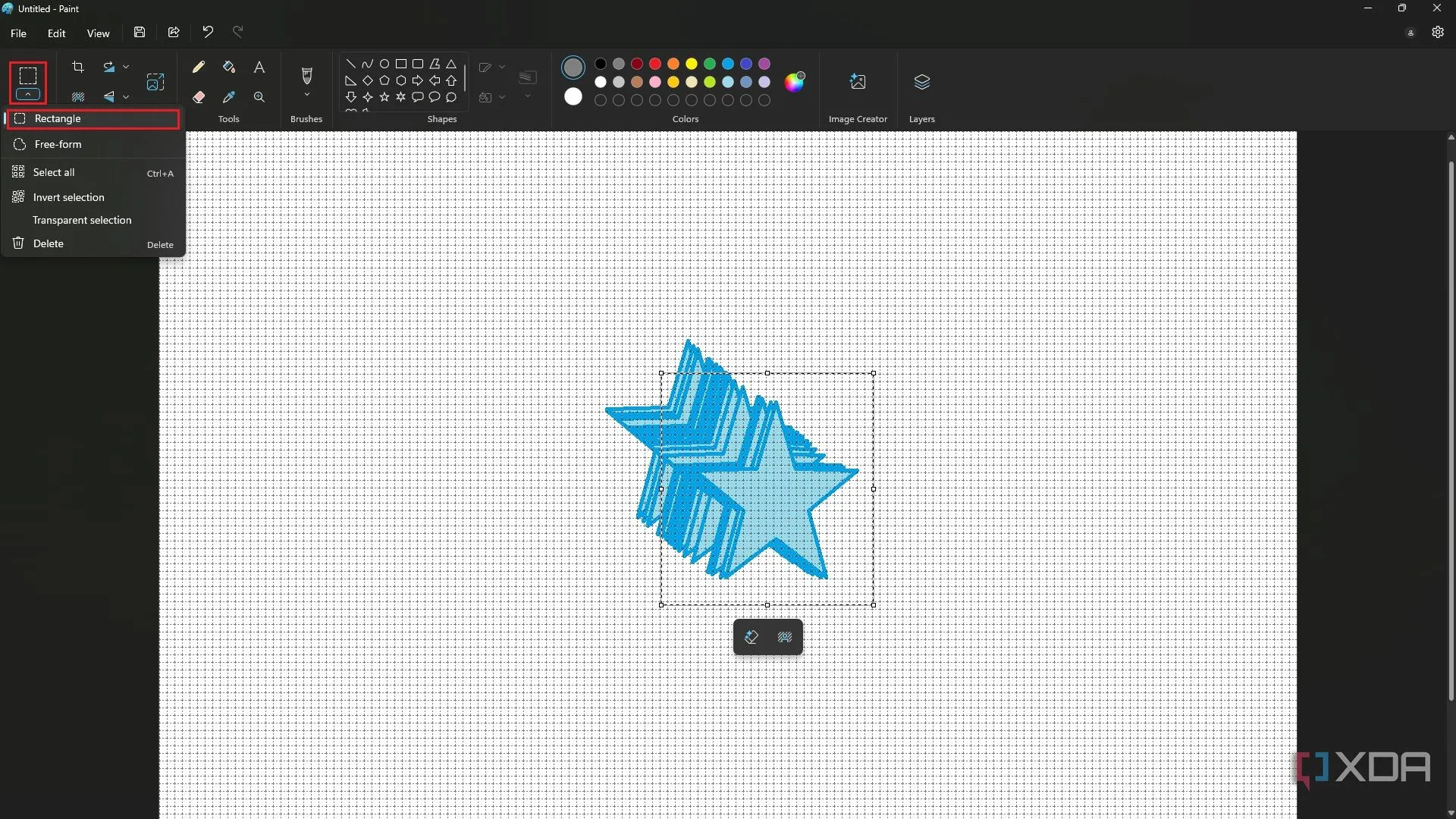 Hiệu ứng glitch độc đáo tạo ra bằng cách kéo vùng chọn với phím Shift trong MS Paint, minh họa trên hình ngôi sao xanh