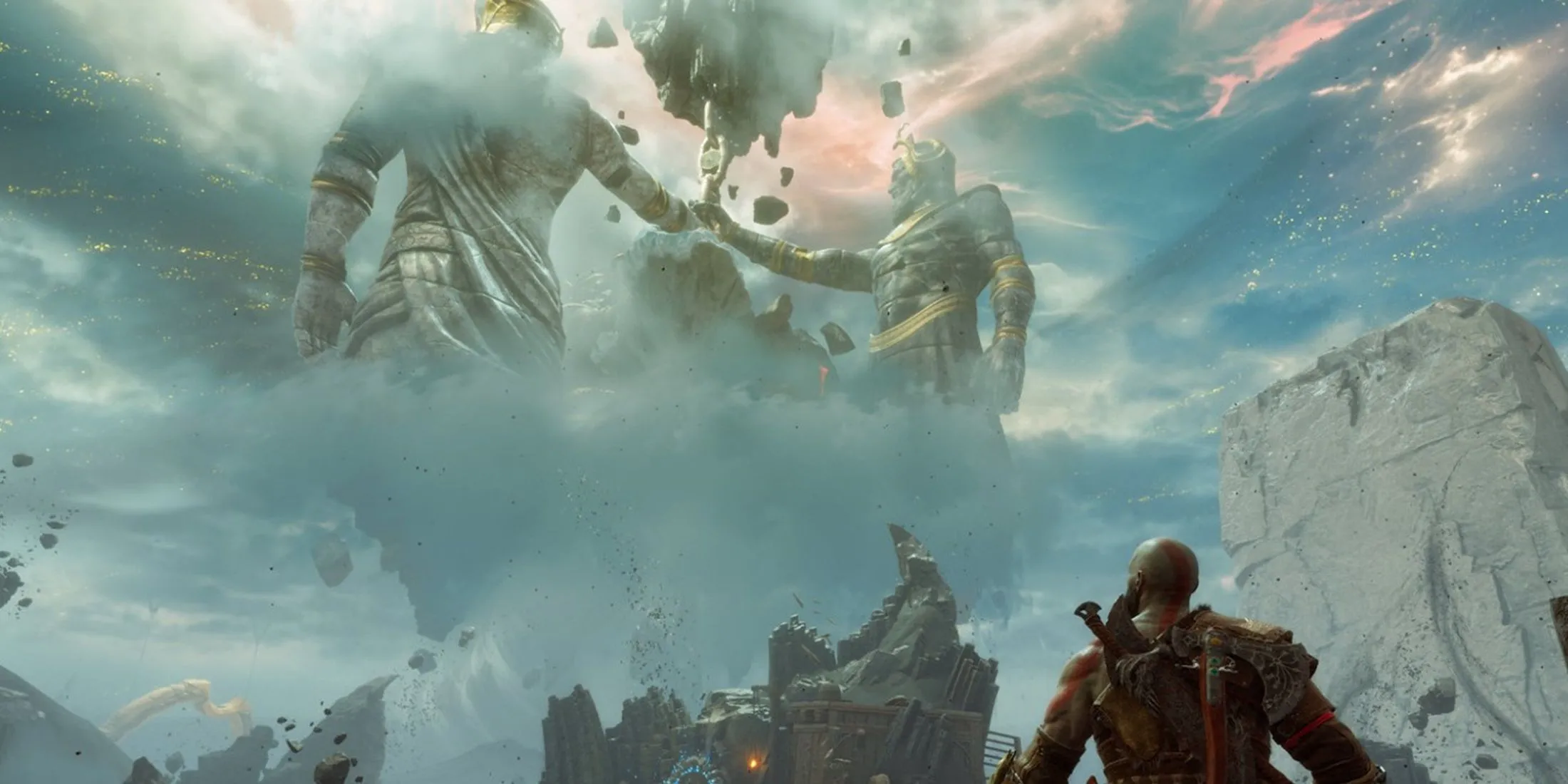 Kratos chiêm ngưỡng những bức tượng khổng lồ trong cảnh quan thần thoại của God of War Ragnarök