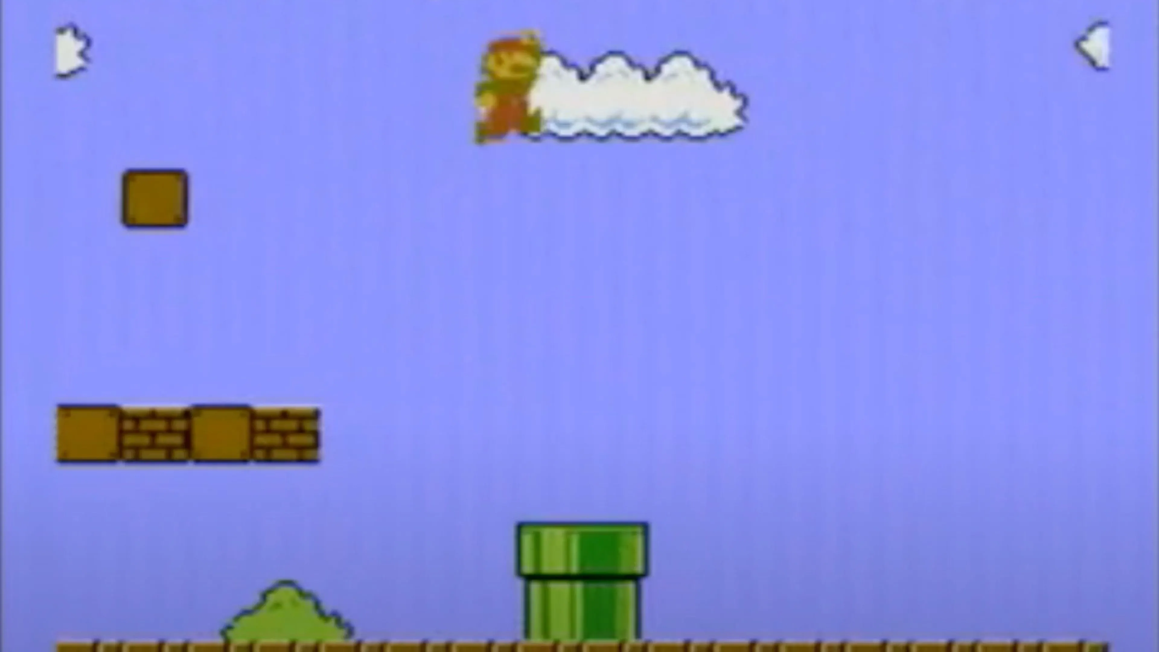 Màn hình gameplay của Super Mario Bros. với Mario đang nhảy qua nấm Goomba