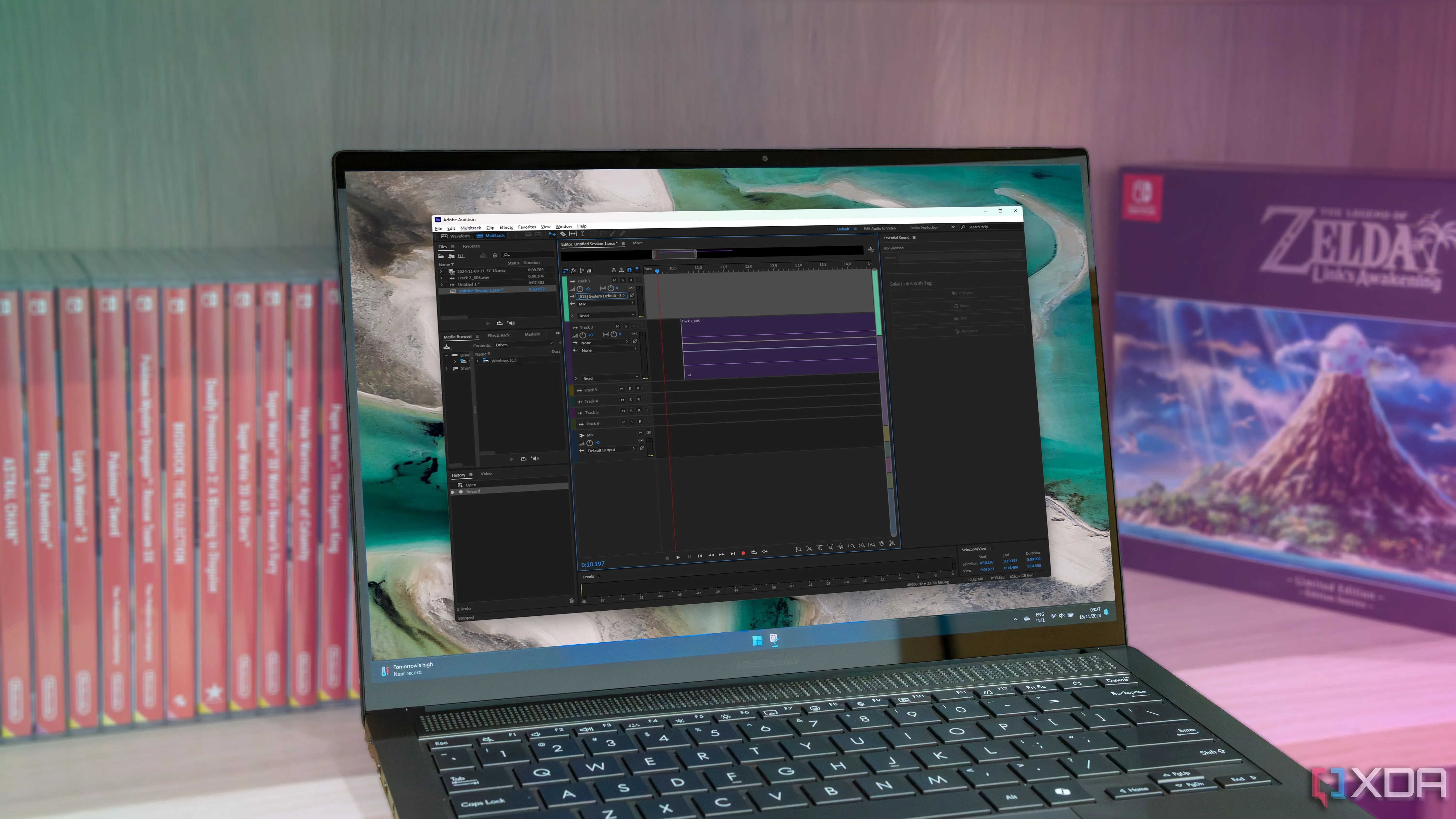 Một chiếc laptop Windows 11 đang chạy Adobe Audition
