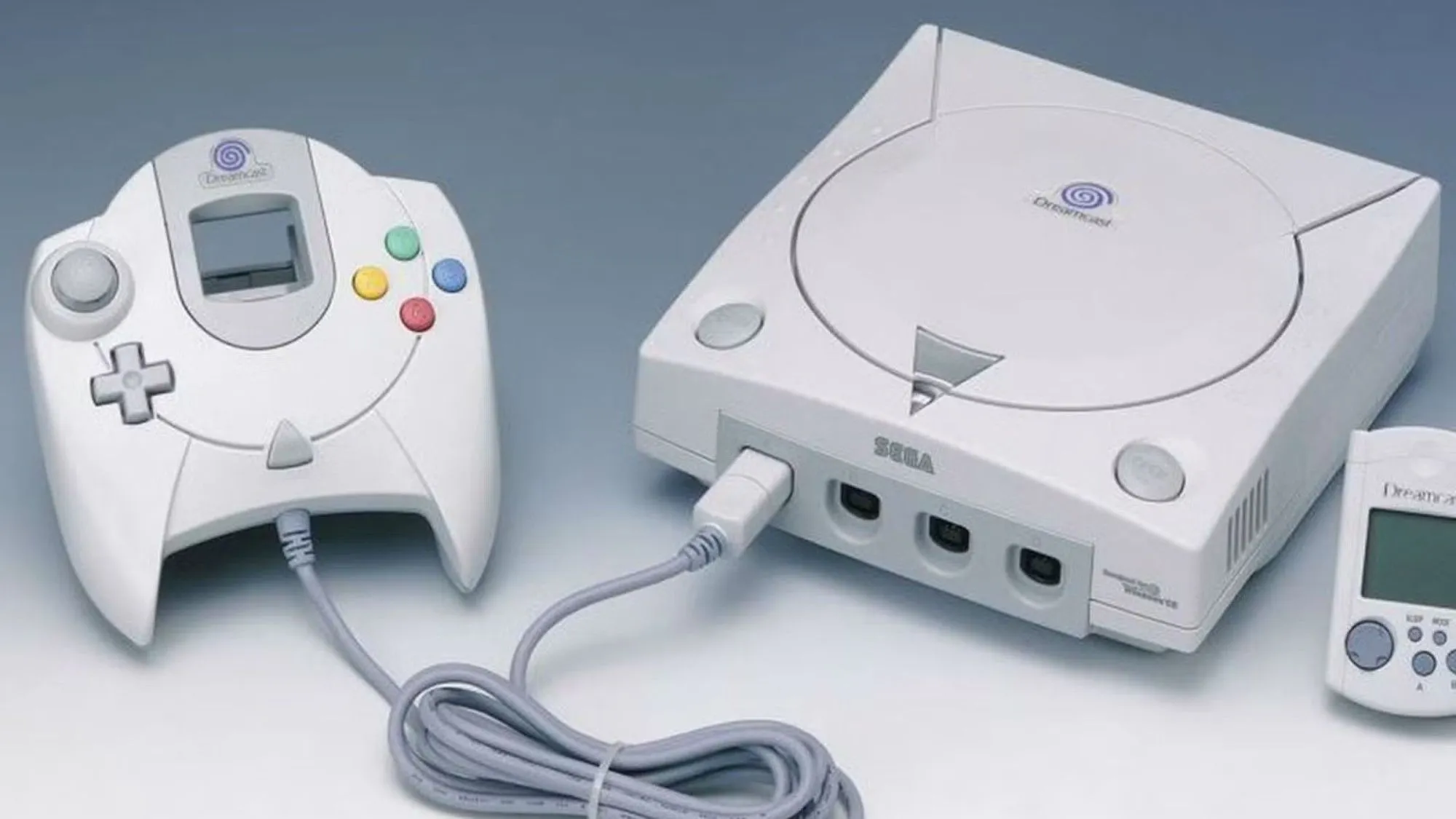 Sega Dreamcast, máy chơi game console màu trắng với logo đặc trưng, bộ điều khiển đi kèm.
