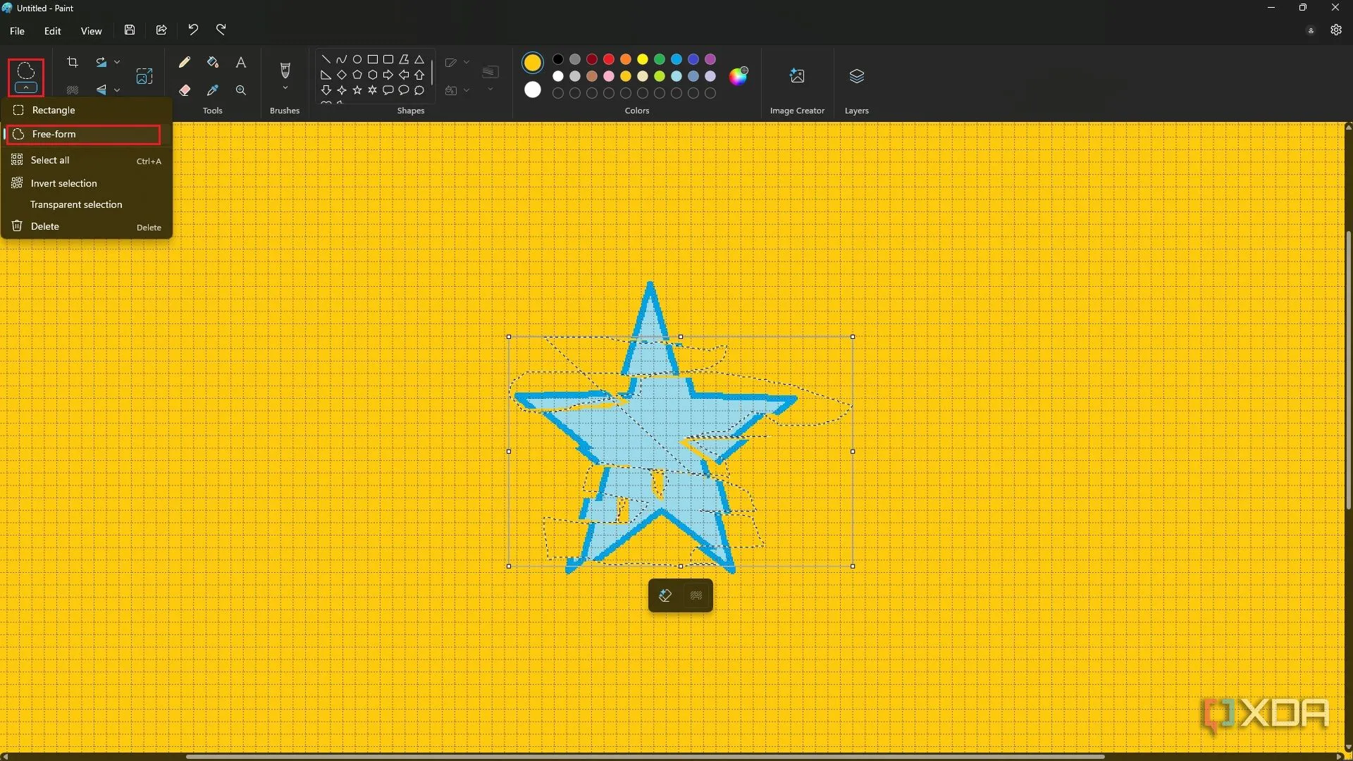 Tạo hiệu ứng glitch thủ công bằng công cụ Freeform Selection trên hình ngôi sao màu xanh trong Paint